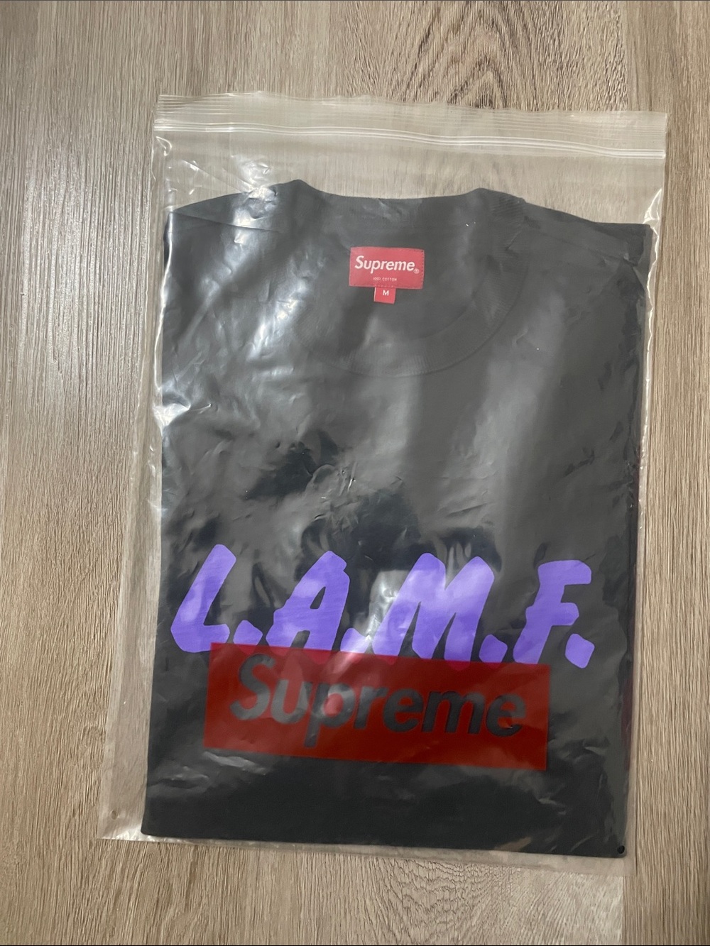 Supreme Black L.A.M.F. Tee with Purple Print